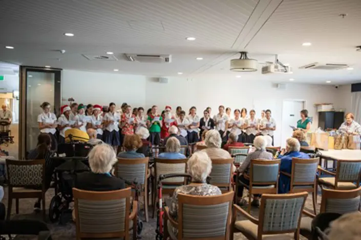 Mount St Benedict students sing carols to McQuoin Park residents